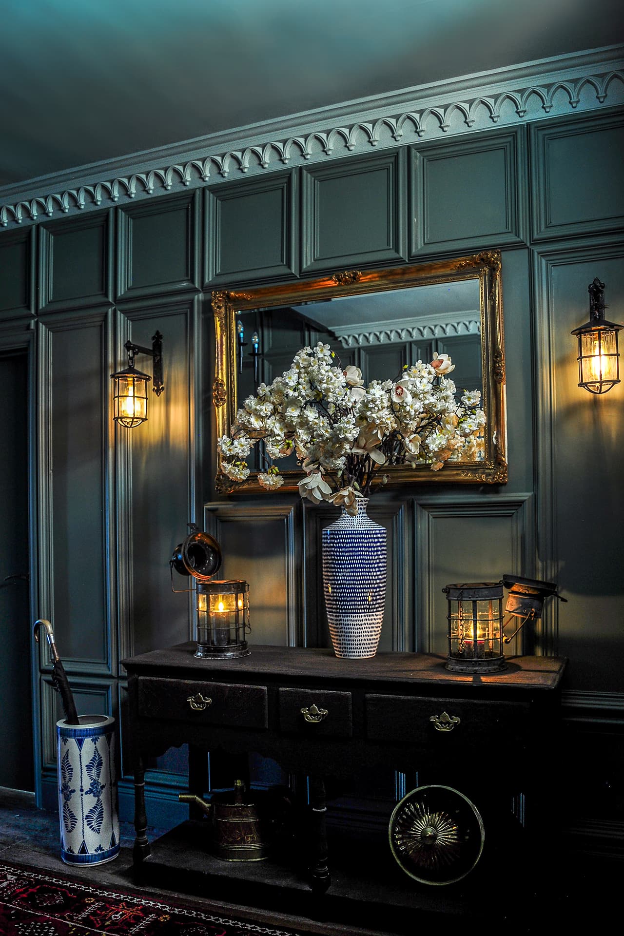 green panelled hallway with gothic style cornice