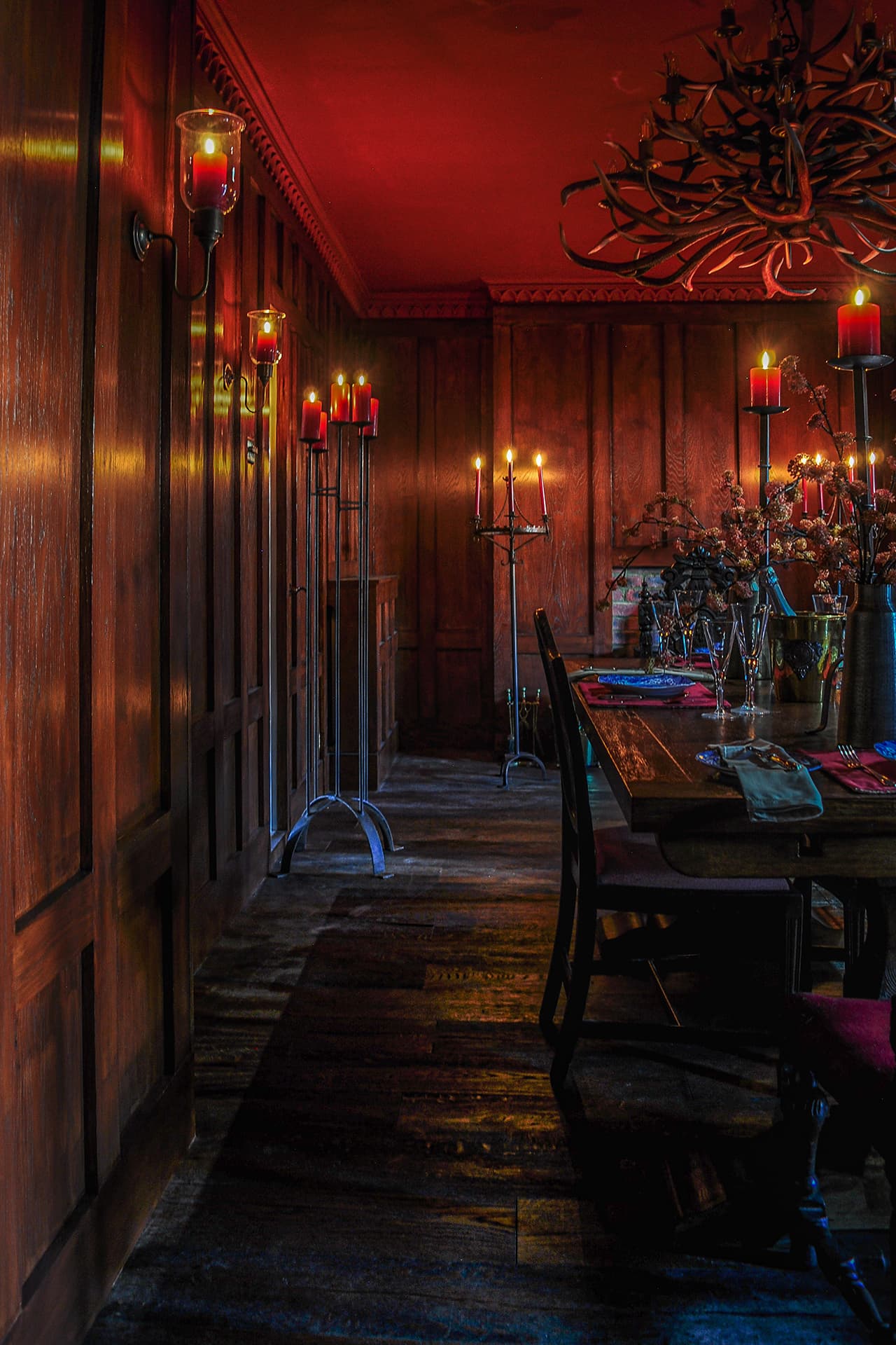 gothic panelled dining room with red ceiling