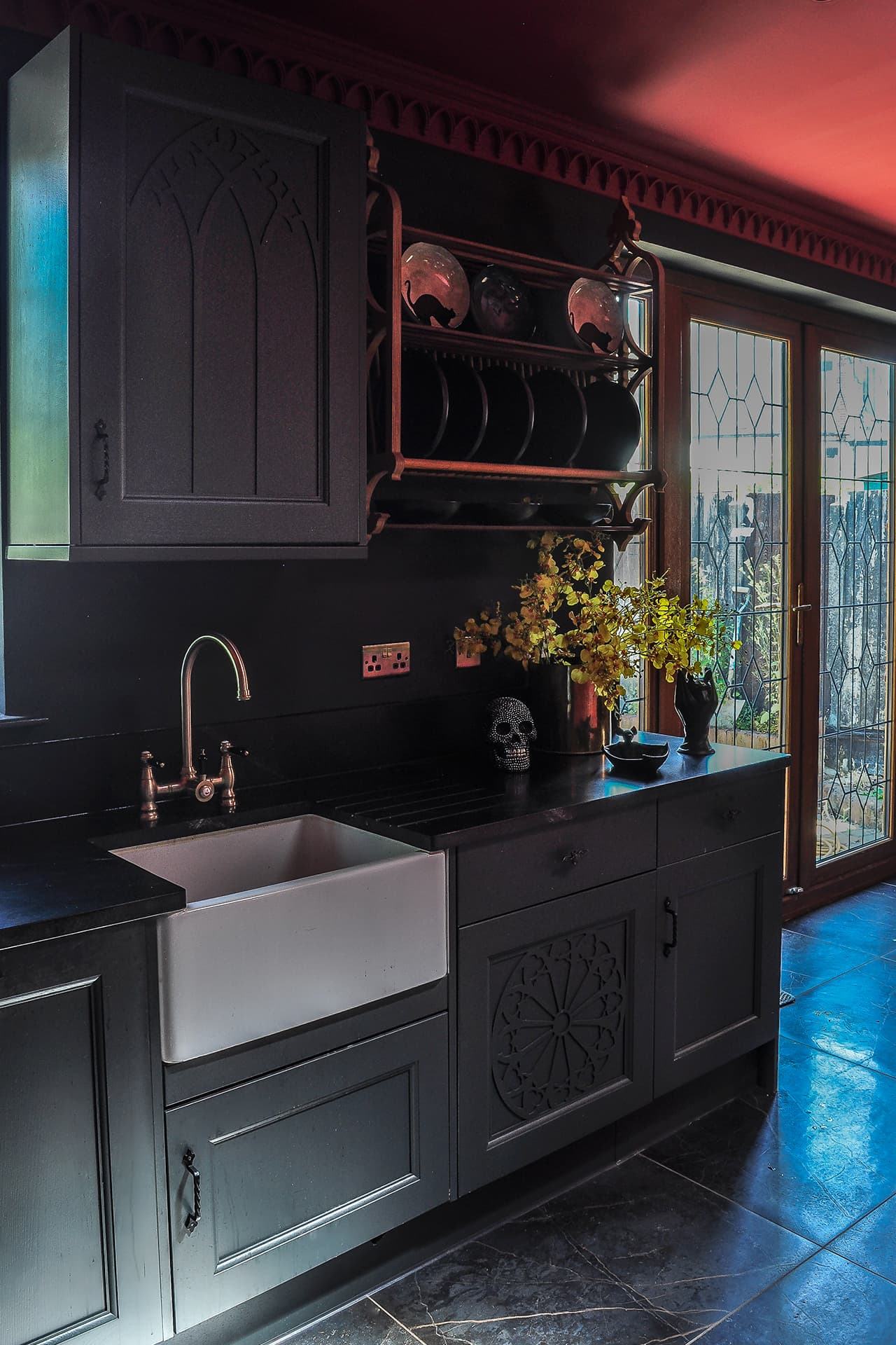 black gothic kicthen with gothic plate rack